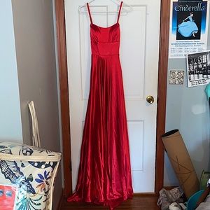 Red satin gown with slit-leg style and pockets